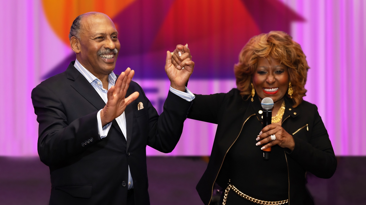 Marcia and Jim Griffin celebrating on stage